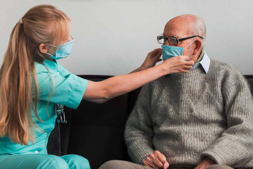nurse-adjusting-old-man-s-medical-mask